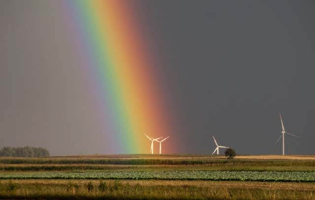 landscape photography of field with wind mill with rainbow 1253748 1