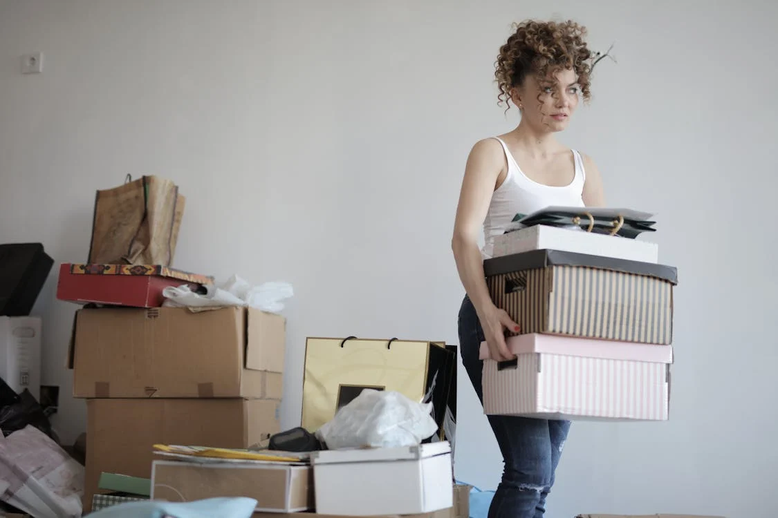 woman moving packed boxes